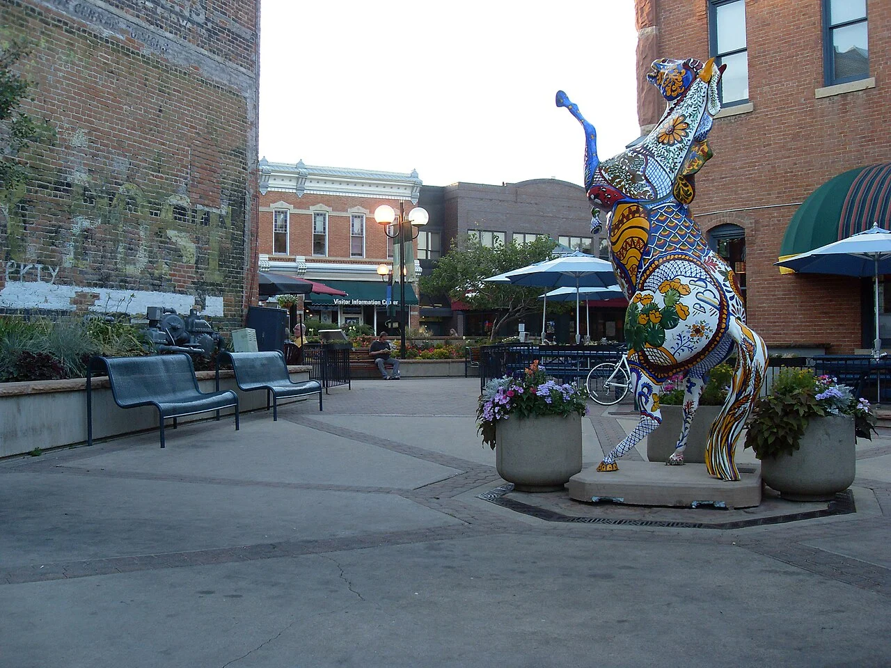 Historic brick storefronts along a street in Old Town Fort Collins, Colorado.
