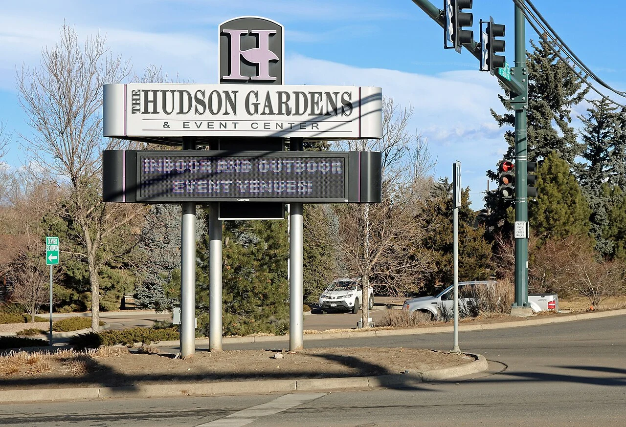 Entrance sign and landscaping at Hudson Gardens in Littleton, Colorado.