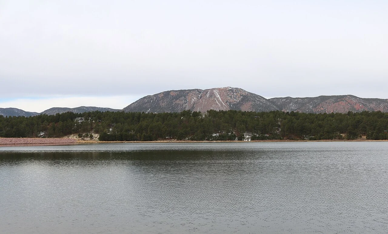 Monument Lake with Mount Herman rising behind the shoreline.