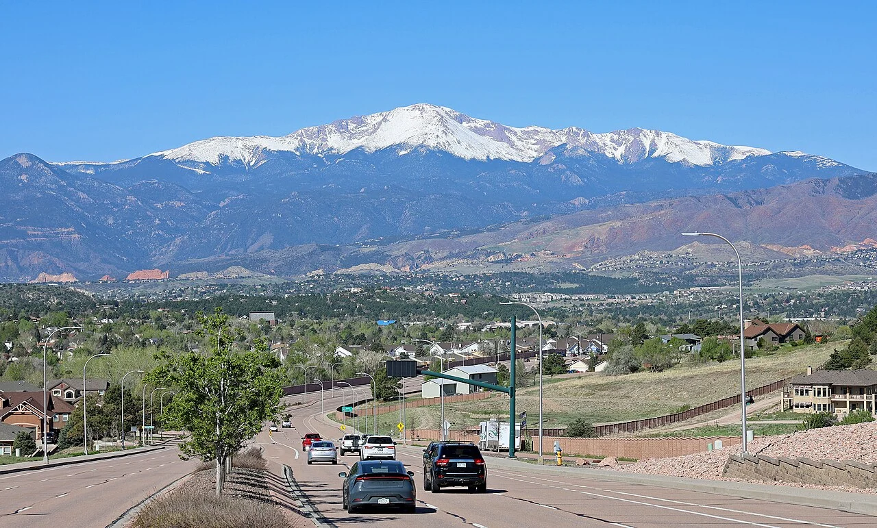 Pikes Peak rising above Colorado Springs neighborhoods viewed from East Woodmen Road.