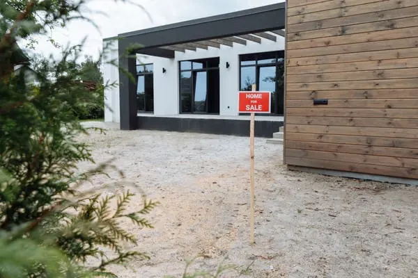 Contemporary home with a sold sign in the front yard.