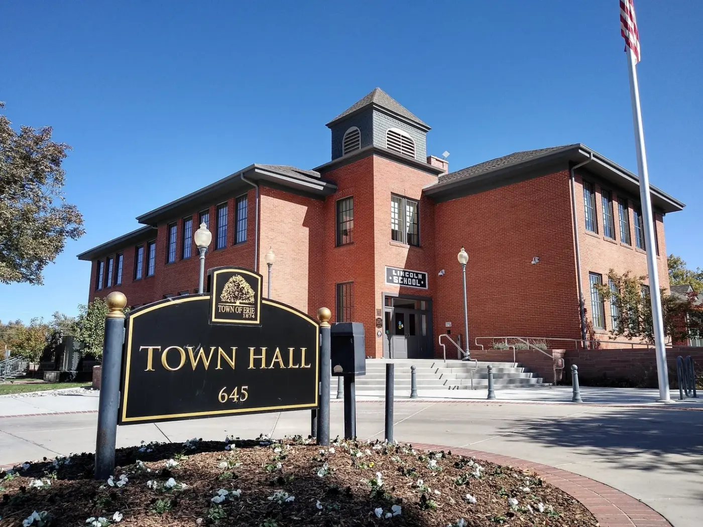 Brick Town Hall building and sign in Erie, Colorado